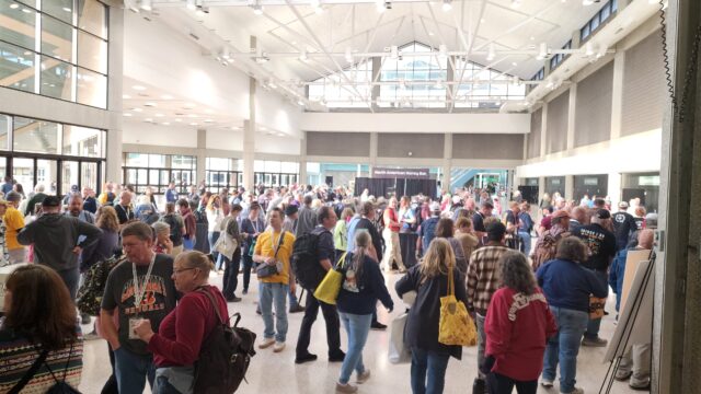 Beekeepers gathering in the crowded outer hall at the 2026 North American Honey Bee Expo